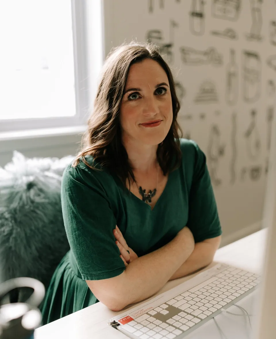Heidi, founder of It's In The Details, at her desk